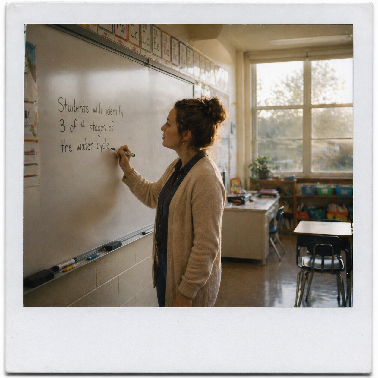 Sarah writing objective on whiteboard
